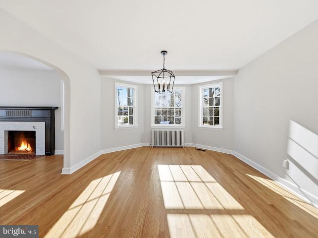 201 Grape Street Hammonton, NJ 08037 - Photo 9 of 34 a view of an empty room with wooden floor fireplace and a window
