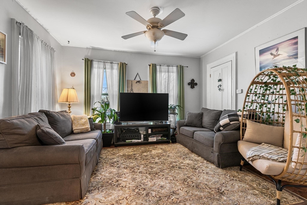 61 Church Street Merrimac, MA 01860 - Photo 11 of 32 a living room with furniture and a flat screen tv