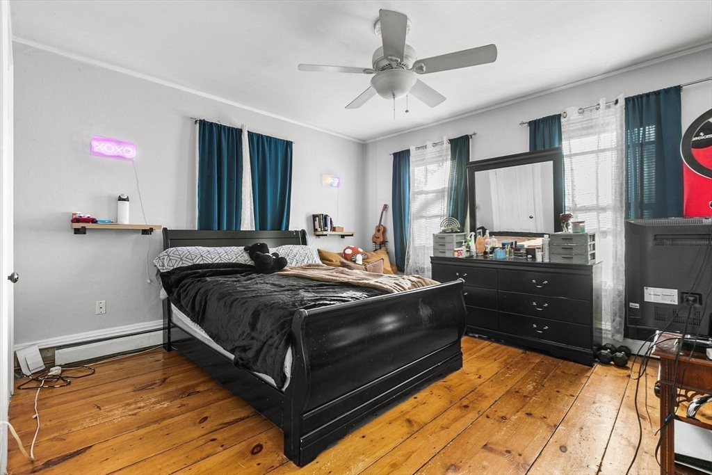 61 Church Street Merrimac, MA 01860 - Photo 12 of 32 a bed room with a bed and a television