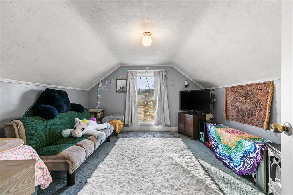 61 Church Street Merrimac, MA 01860 - Photo 15 of 32 a living room with furniture and a flat screen tv