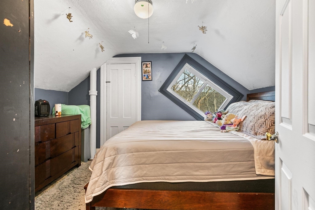 61 Church Street Merrimac, MA 01860 - Photo 16 of 32 a bedroom with a bed and a cabinets