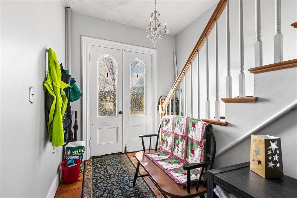 61 Church Street Merrimac, MA 01860 - Photo 18 of 32 a living room with furniture and a chandelier