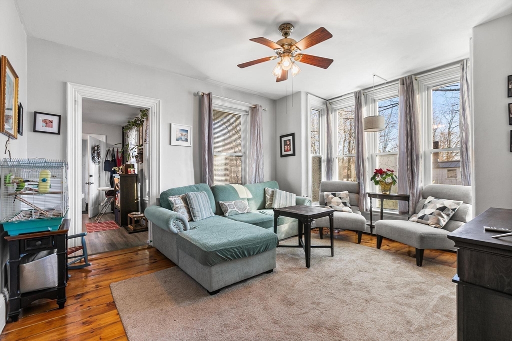 61 Church Street Merrimac, MA 01860 - Photo 5 of 32 a living room with furniture and a large window