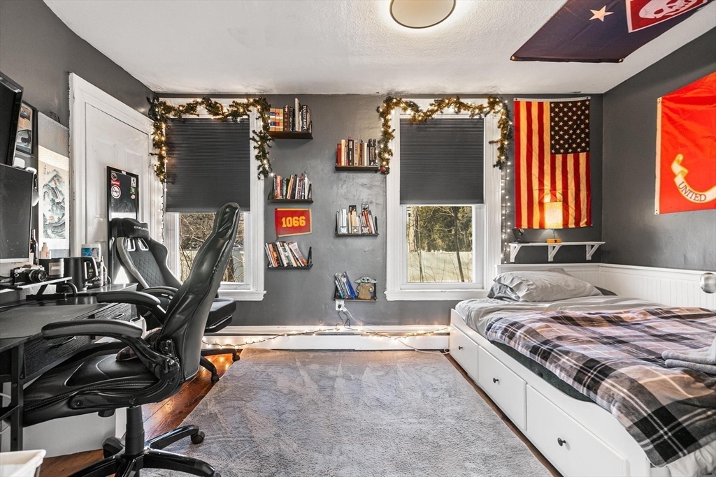 61 Church Street Merrimac, MA 01860 - Photo 6 of 32 a living room with large windows and a table