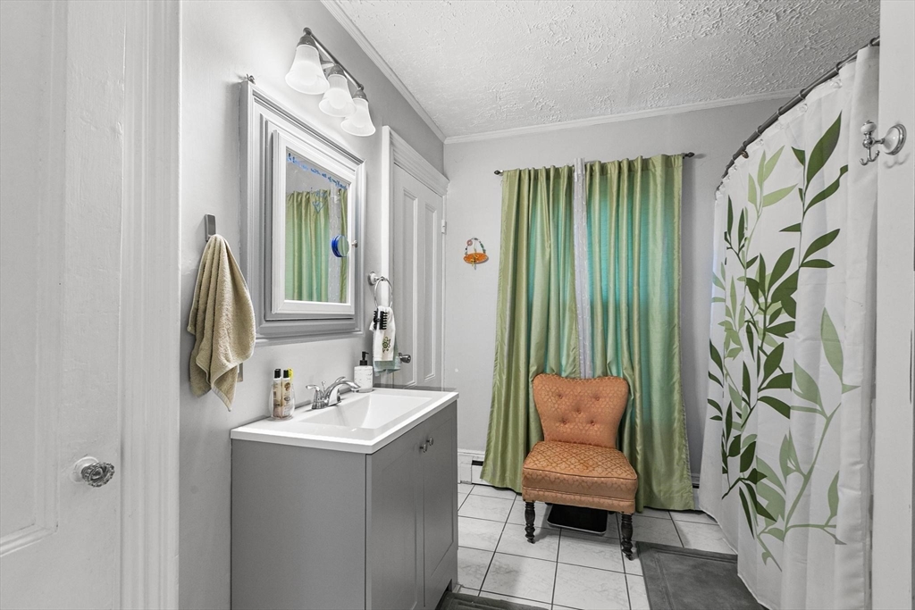 61 Church Street Merrimac, MA 01860 - Photo 8 of 32 a bathroom with a sink and a mirror