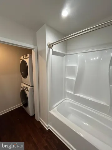 a bathroom with a shower and a tub