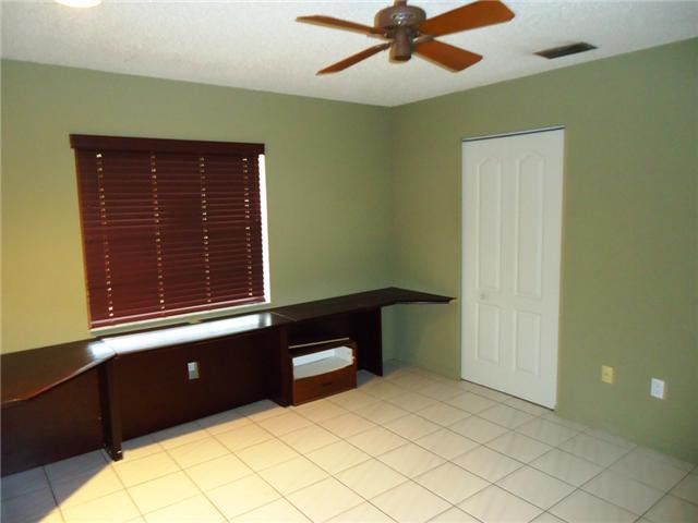 21218 Lago Circle, Unit B Boca Raton, FL 33433 - Photo 11 of 25 a bedroom with a bed and a window