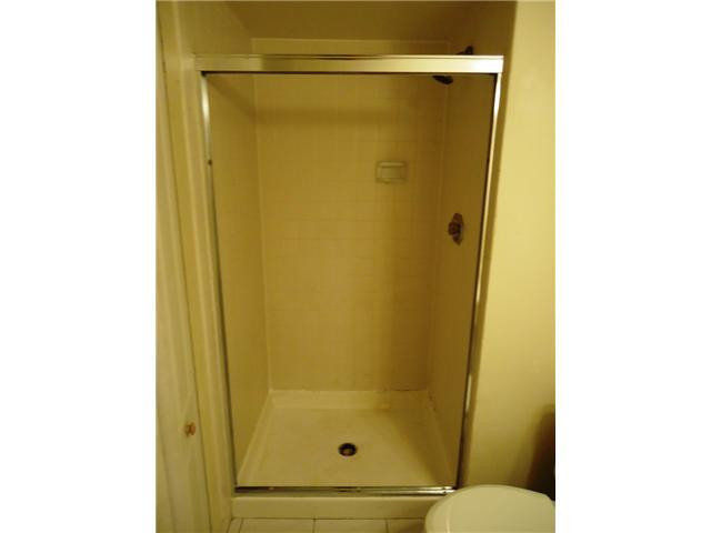 21218 Lago Circle, Unit B Boca Raton, FL 33433 - Photo 13 of 25 a bathroom with a shower and a toilet