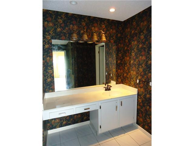 21218 Lago Circle, Unit B Boca Raton, FL 33433 - Photo 16 of 25 a bathroom with a sink and a mirror