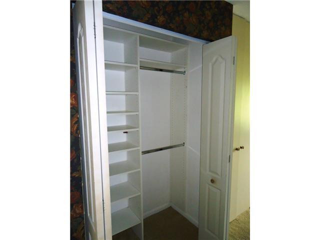 21218 Lago Circle, Unit B Boca Raton, FL 33433 - Photo 18 of 25 a bathroom with a glass shower door