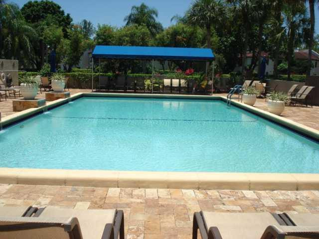21218 Lago Circle, Unit B Boca Raton, FL 33433 - Photo 23 of 25 a view of a swimming pool with a patio