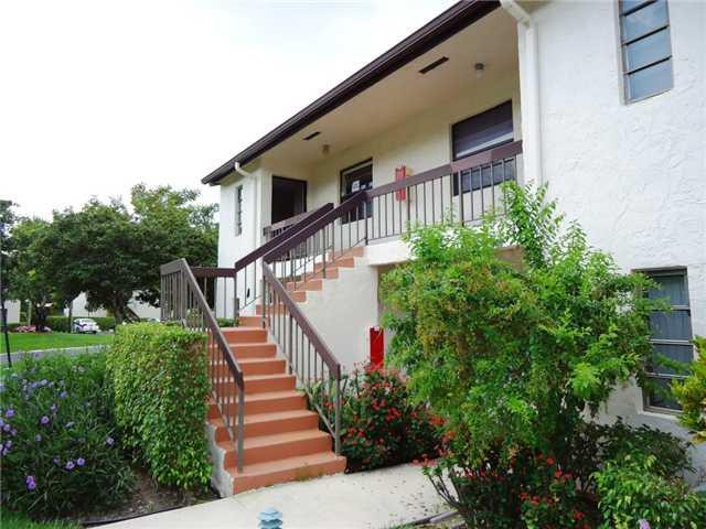 21218 Lago Circle, Unit B Boca Raton, FL 33433 - Photo 3 of 25 a view of a house with wooden stairs