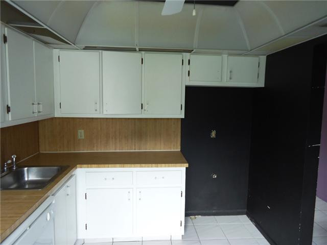 21218 Lago Circle, Unit B Boca Raton, FL 33433 - Photo 9 of 25 a kitchen with a sink and cabinets