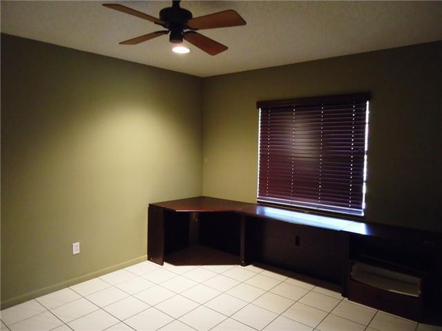21218 Lago Circle, Unit B Boca Raton, FL 33433 - Photo 10 of 25 a view of wooden floor and chandelier fan in a room