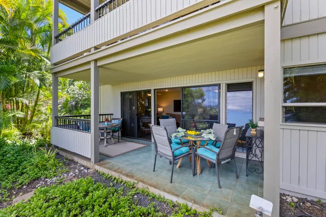 a view of a tables and chairs in patio of the house