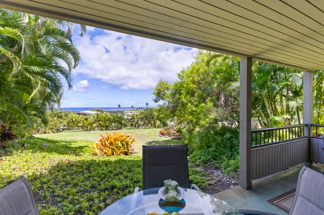 a view of a garden from a balcony
