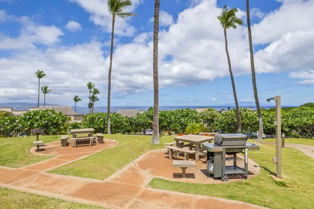 a view of a patio with a table and chairs