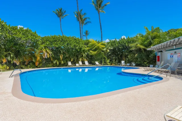 a view of a swimming pool with a patio