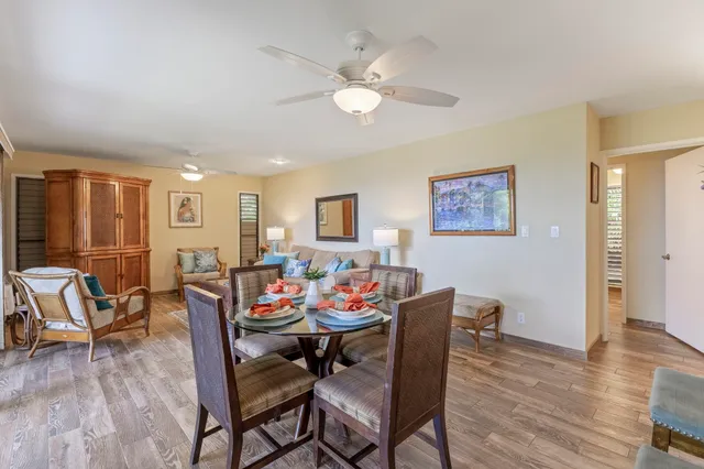 a view of a dining room with furniture and wooden floor