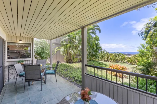 a view of a patio with a table chairs and a table
