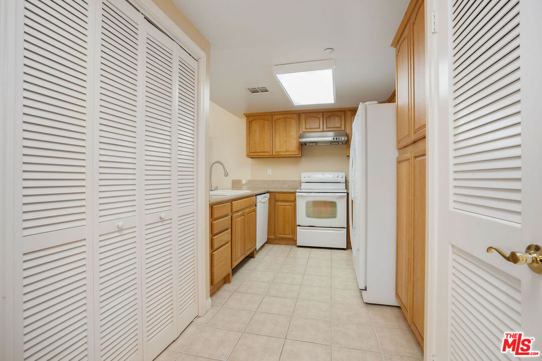 1128 West Duarte Road, Unit A Arcadia, CA 91007 - Photo 12 of 28 a kitchen with stainless steel appliances a refrigerator and a sink