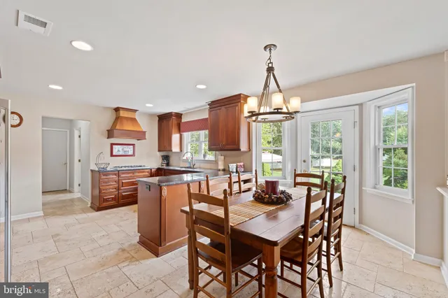 a dining room with furniture window wooden floor