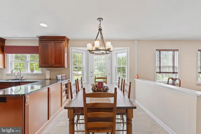 a kitchen with stainless steel appliances granite countertop sink stove and cabinets