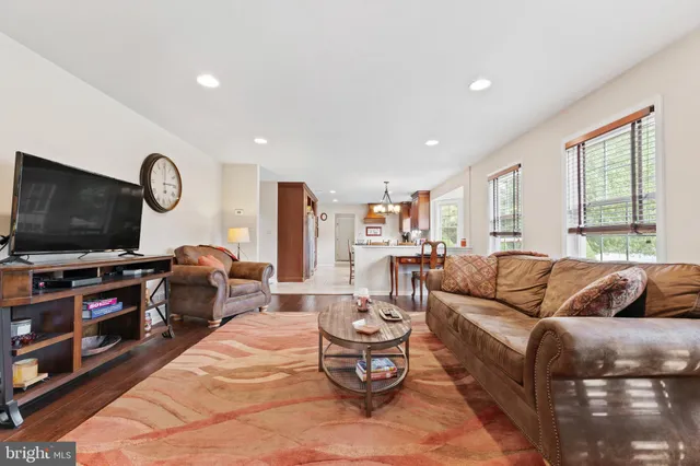 a bathroom with a sink toilet and a mirror