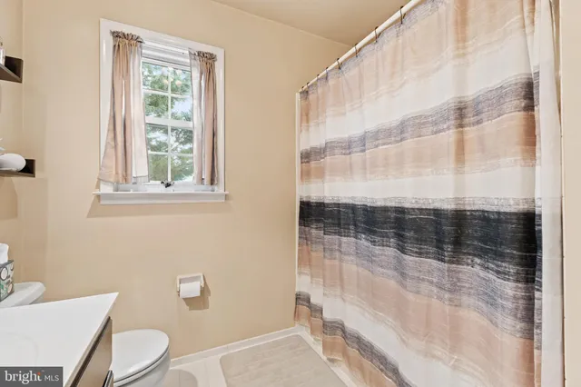 a room with furniture and pool table