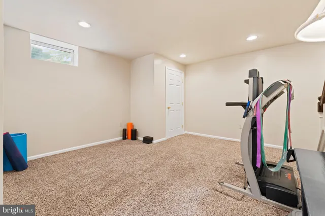 a view of a house with basketball court