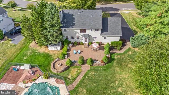 a view of a backyard with sitting area
