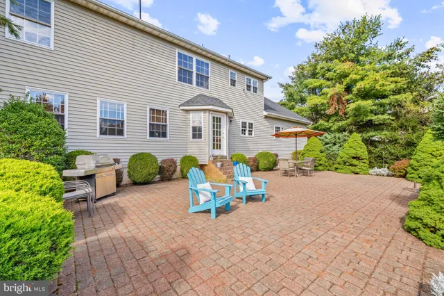 a view of a chairs and table in the patio