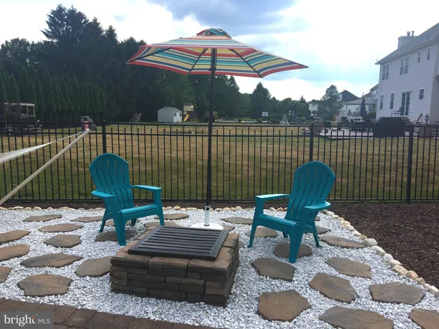 an aerial view of a house with a yard basket ball court