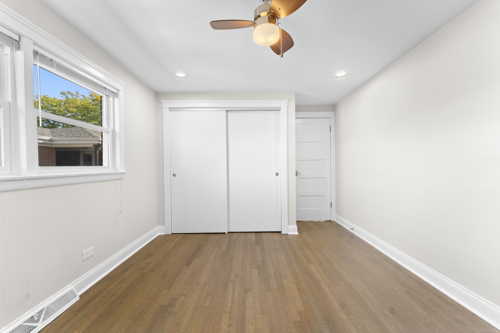 716 North Western Avenue Park Ridge, IL 60068 - Photo 17 of 26 an empty room with wooden floor and windows