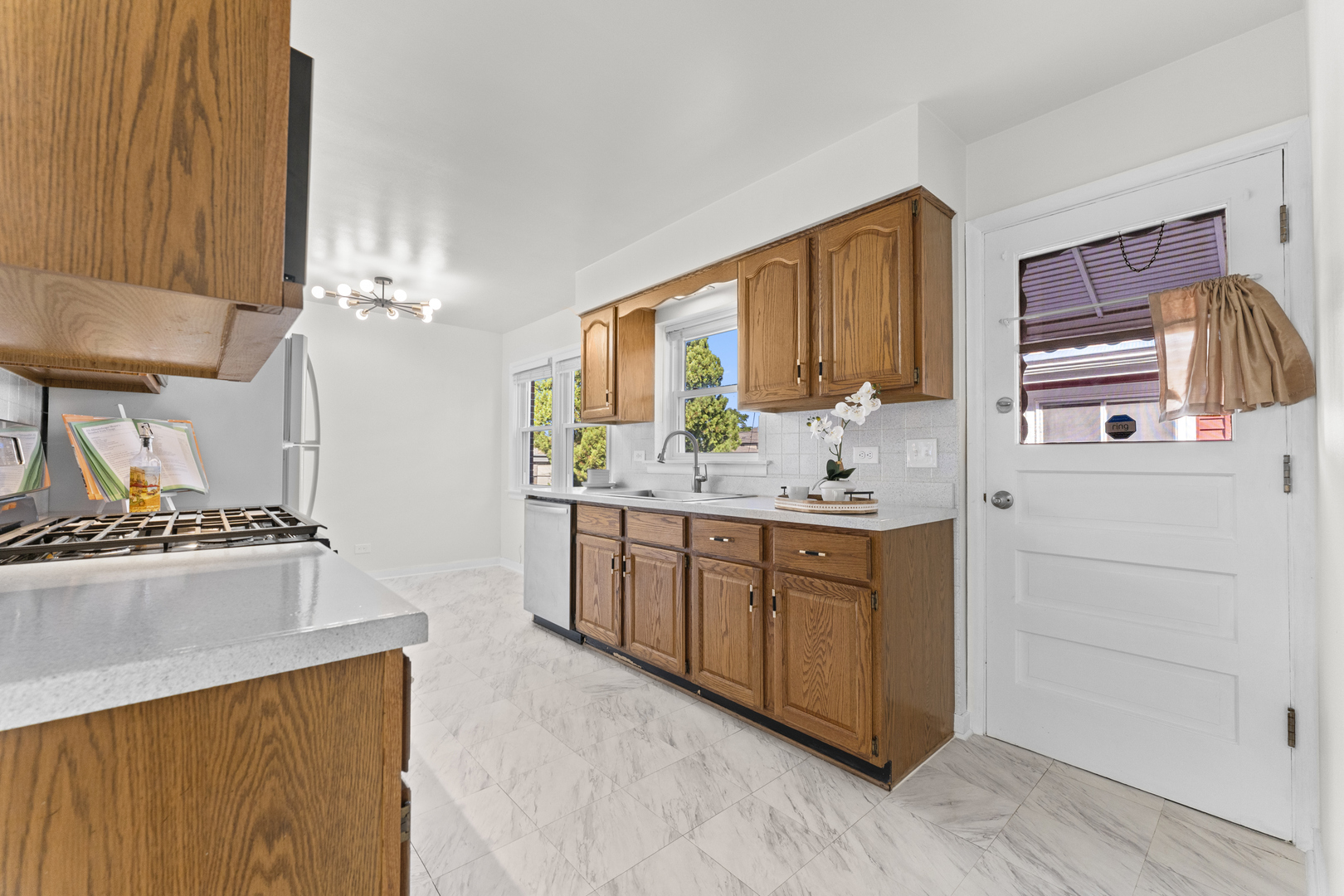 716 North Western Avenue Park Ridge, IL 60068 - Photo 6 of 26 a kitchen with stainless steel appliances a stove a sink and a refrigerator