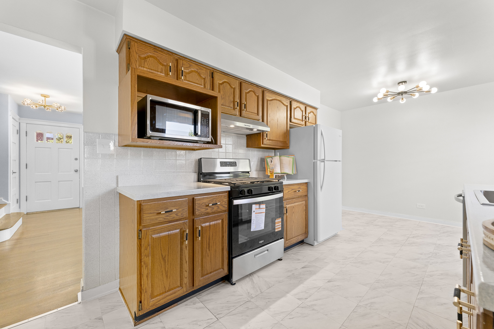 716 North Western Avenue Park Ridge, IL 60068 - Photo 7 of 26 a kitchen with stainless steel appliances granite countertop a stove and a sink