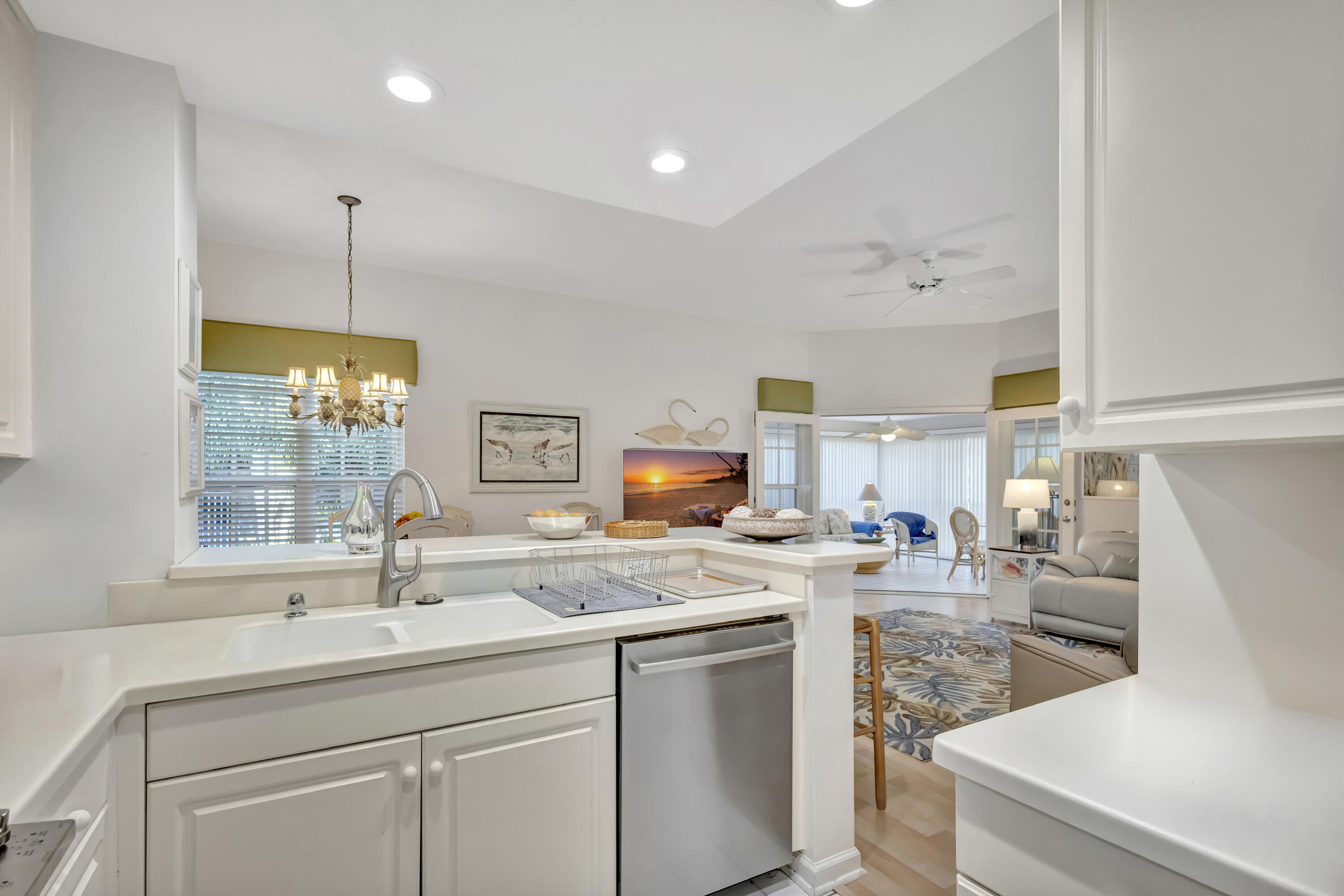411 Northeast Plantation Road, Unit 522 Stuart, FL 34996 - Photo 12 of 52 a kitchen with a sink cabinets and window