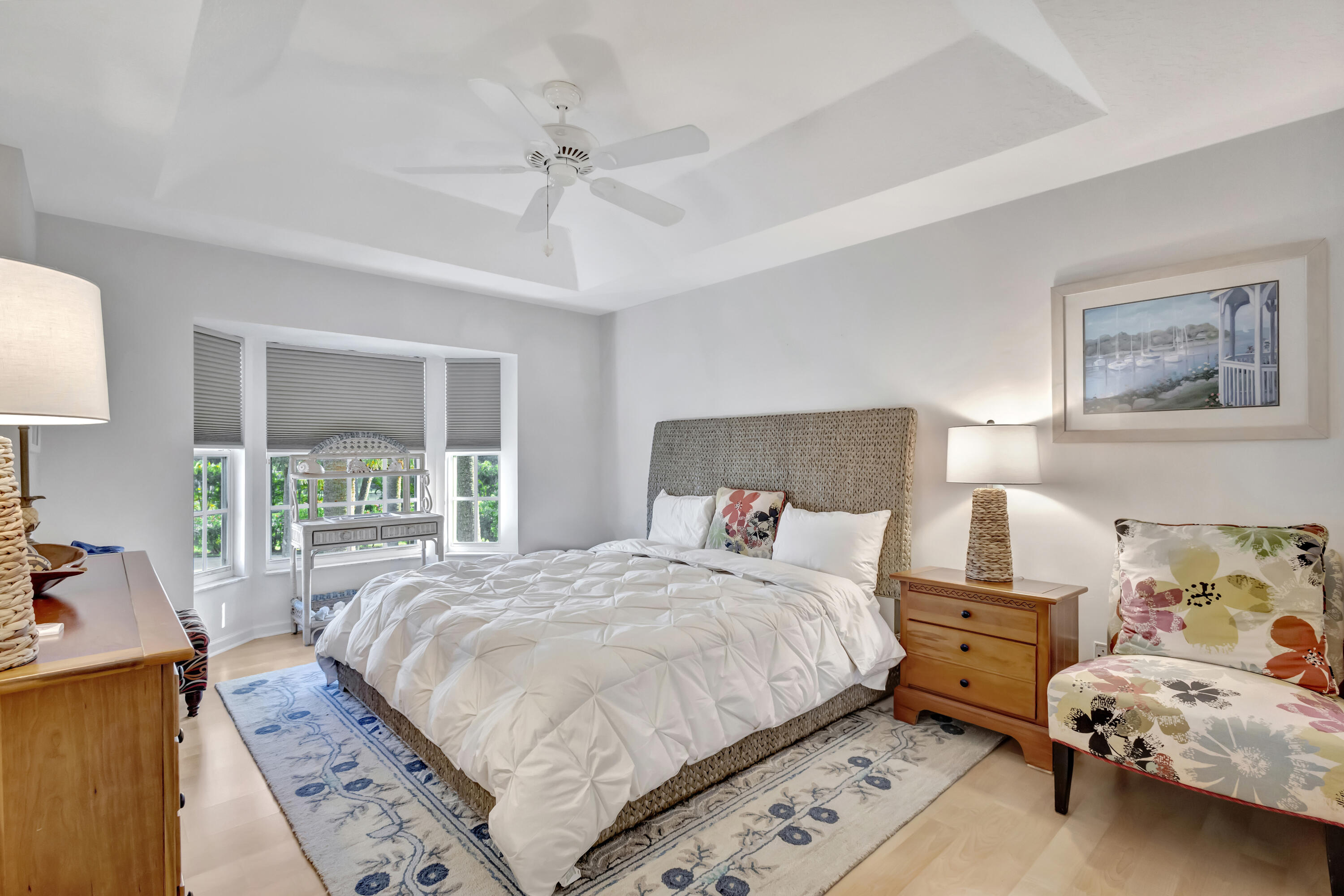 411 Northeast Plantation Road, Unit 522 Stuart, FL 34996 - Photo 15 of 52 a bedroom with a bed and a large window