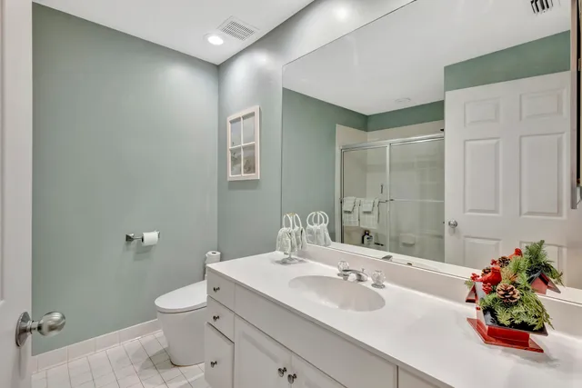 a bathroom with a glass shower door