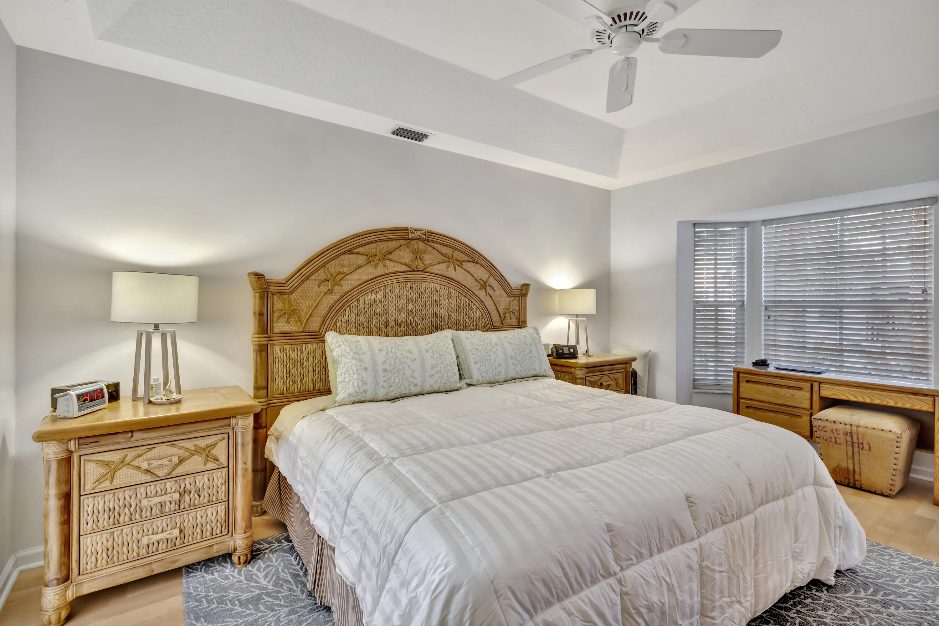 411 Northeast Plantation Road, Unit 522 Stuart, FL 34996 - Photo 21 of 52 a bedroom with a bed and a chandelier