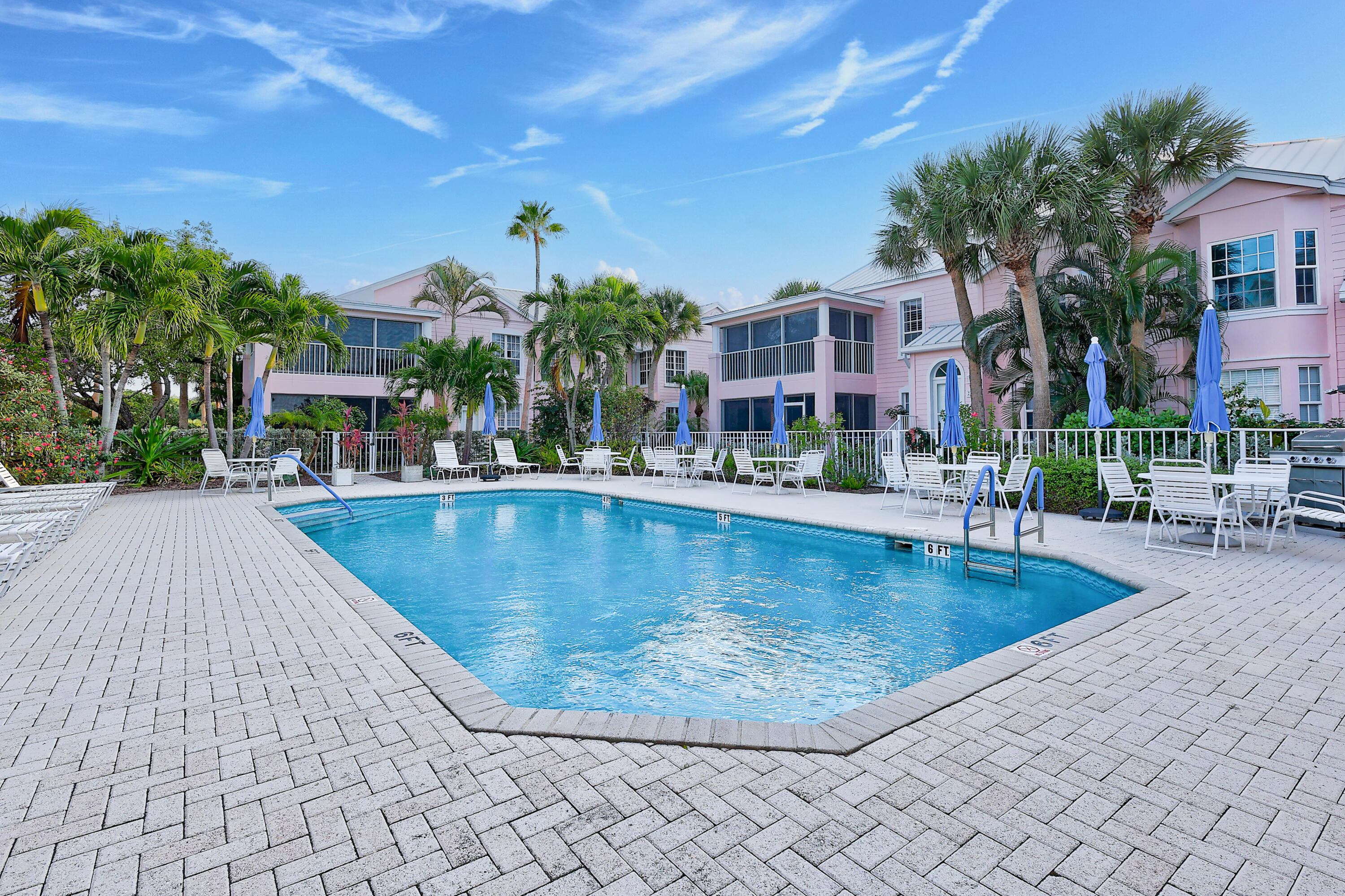 411 Northeast Plantation Road, Unit 522 Stuart, FL 34996 - Photo 30 of 52 a view of a swimming pool with a patio