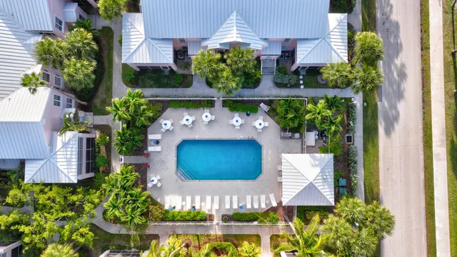 a view of a pool table and chairs