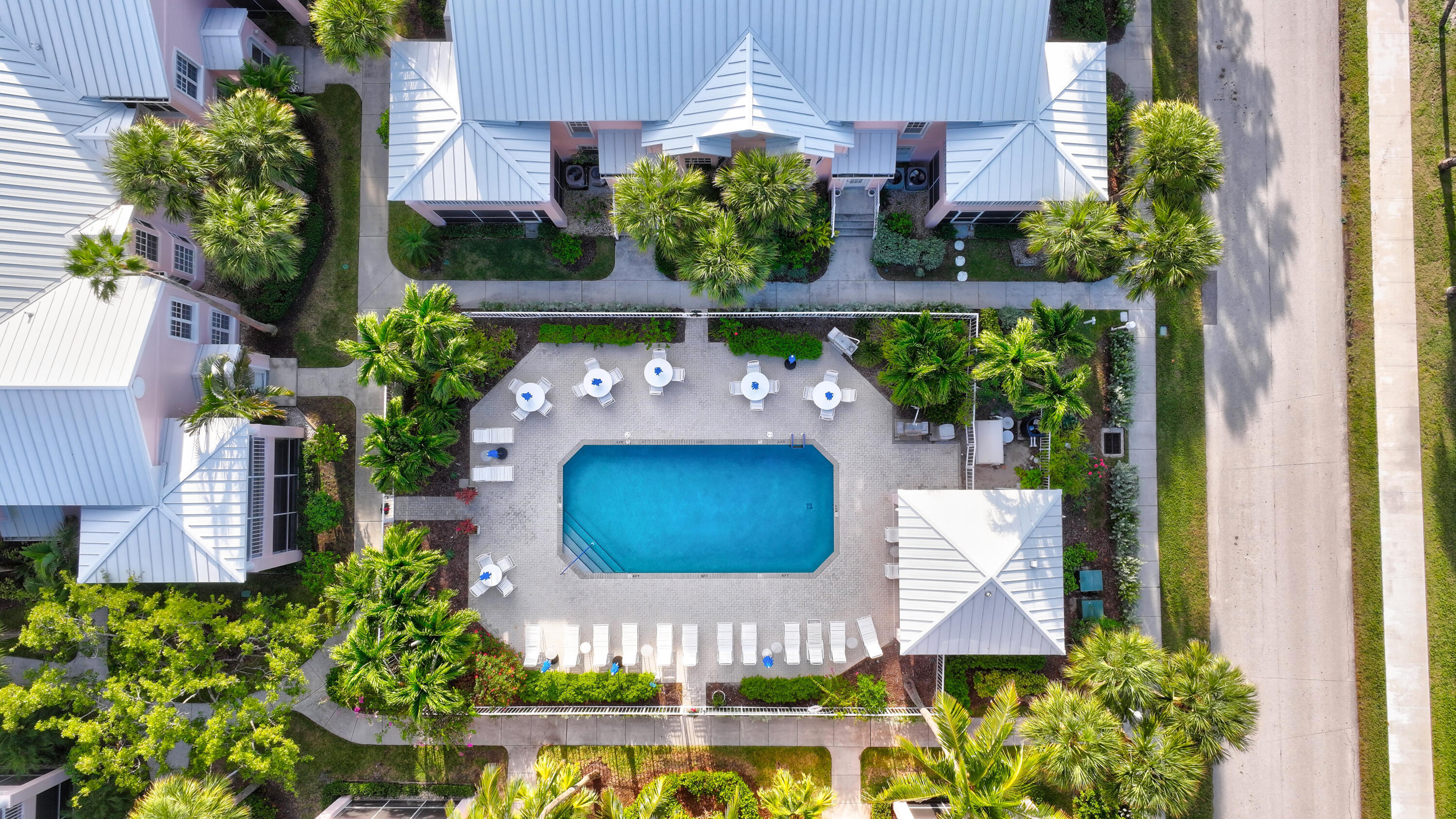 411 Northeast Plantation Road, Unit 522 Stuart, FL 34996 - Photo 40 of 52 a potted plant sitting in front of a house