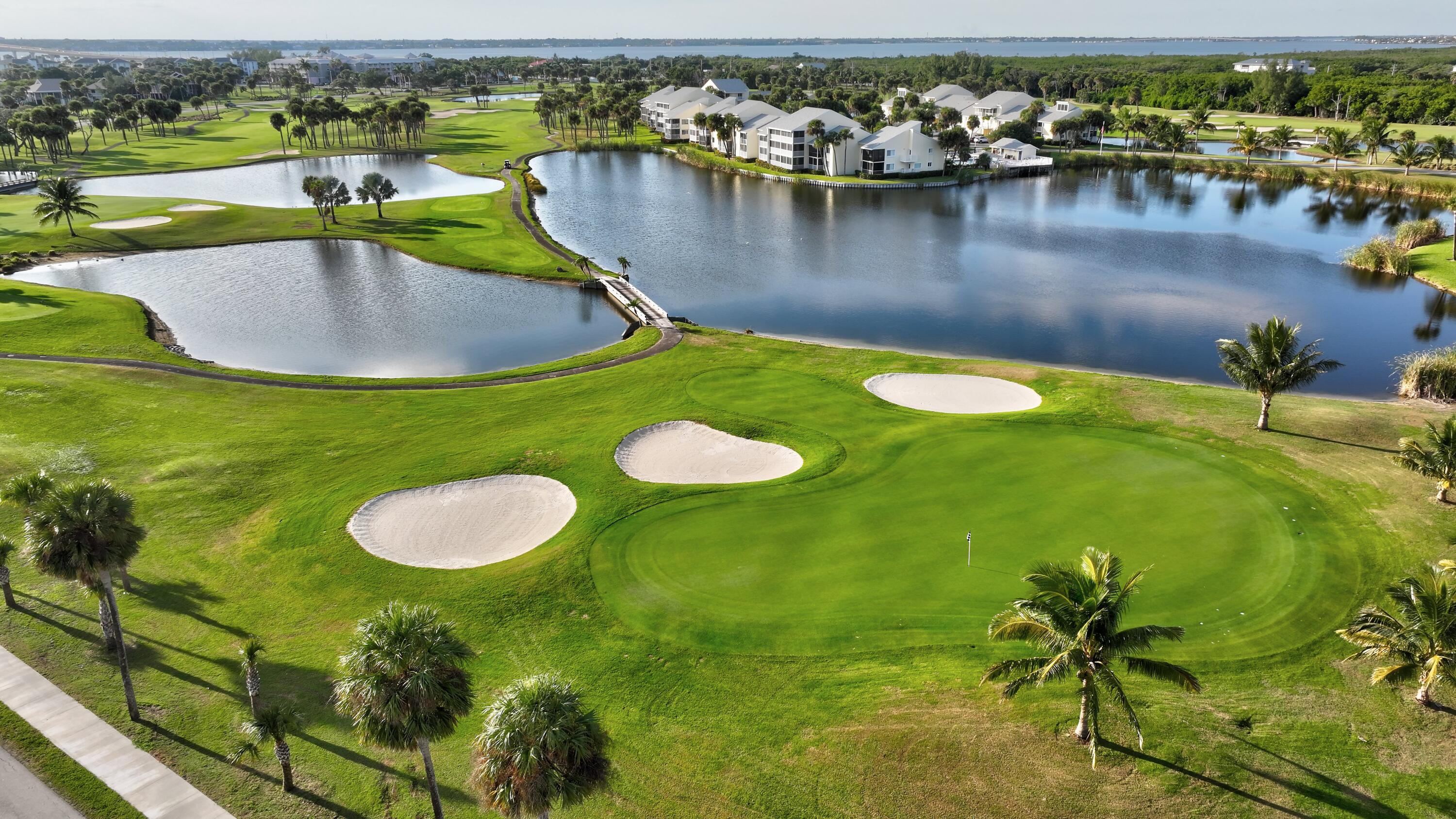 411 Northeast Plantation Road, Unit 522 Stuart, FL 34996 - Photo 41 of 52 a view of a lake with a mountain