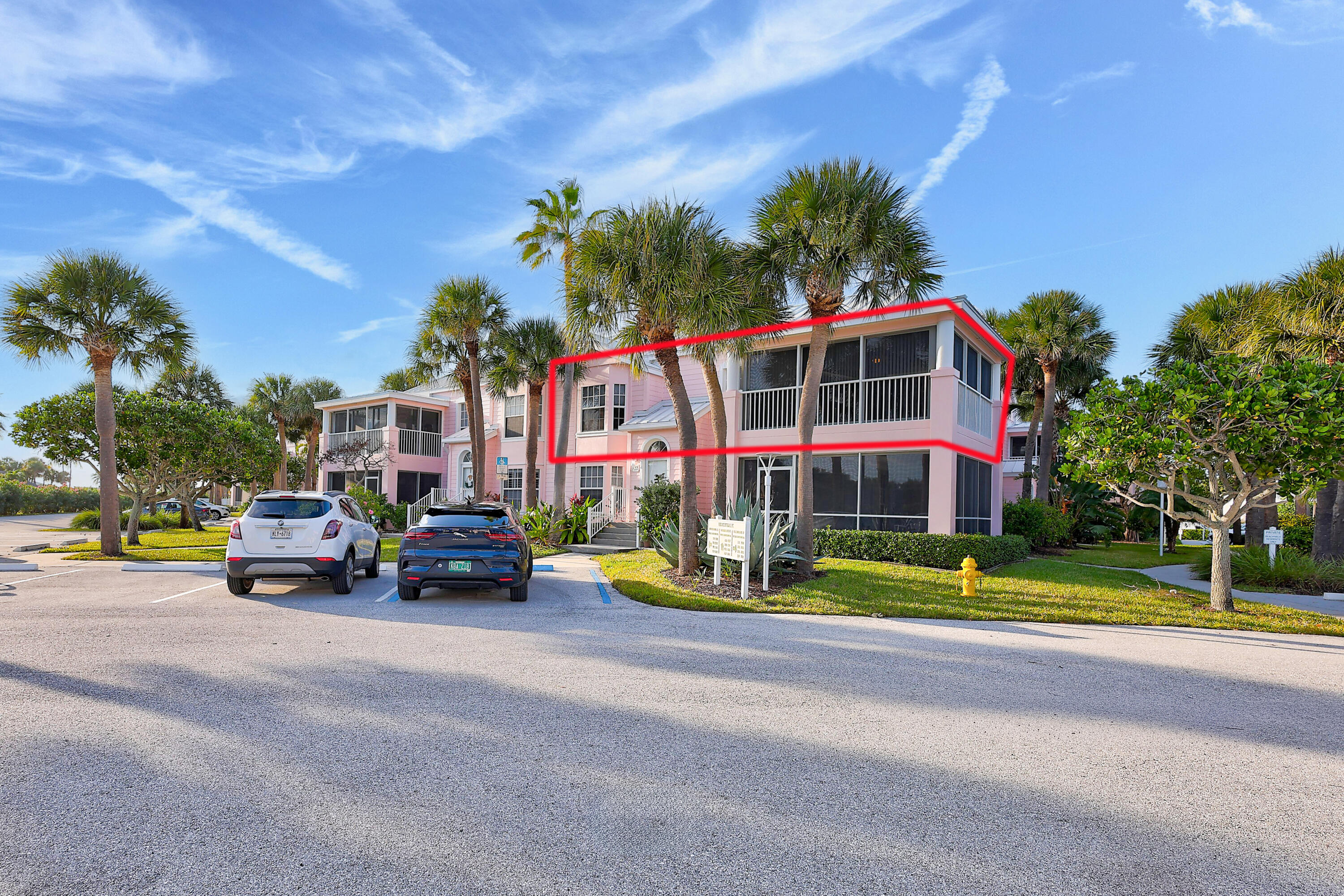 411 Northeast Plantation Road, Unit 522 Stuart, FL 34996 - Photo 51 of 52 a view of a parked cars in front of a house