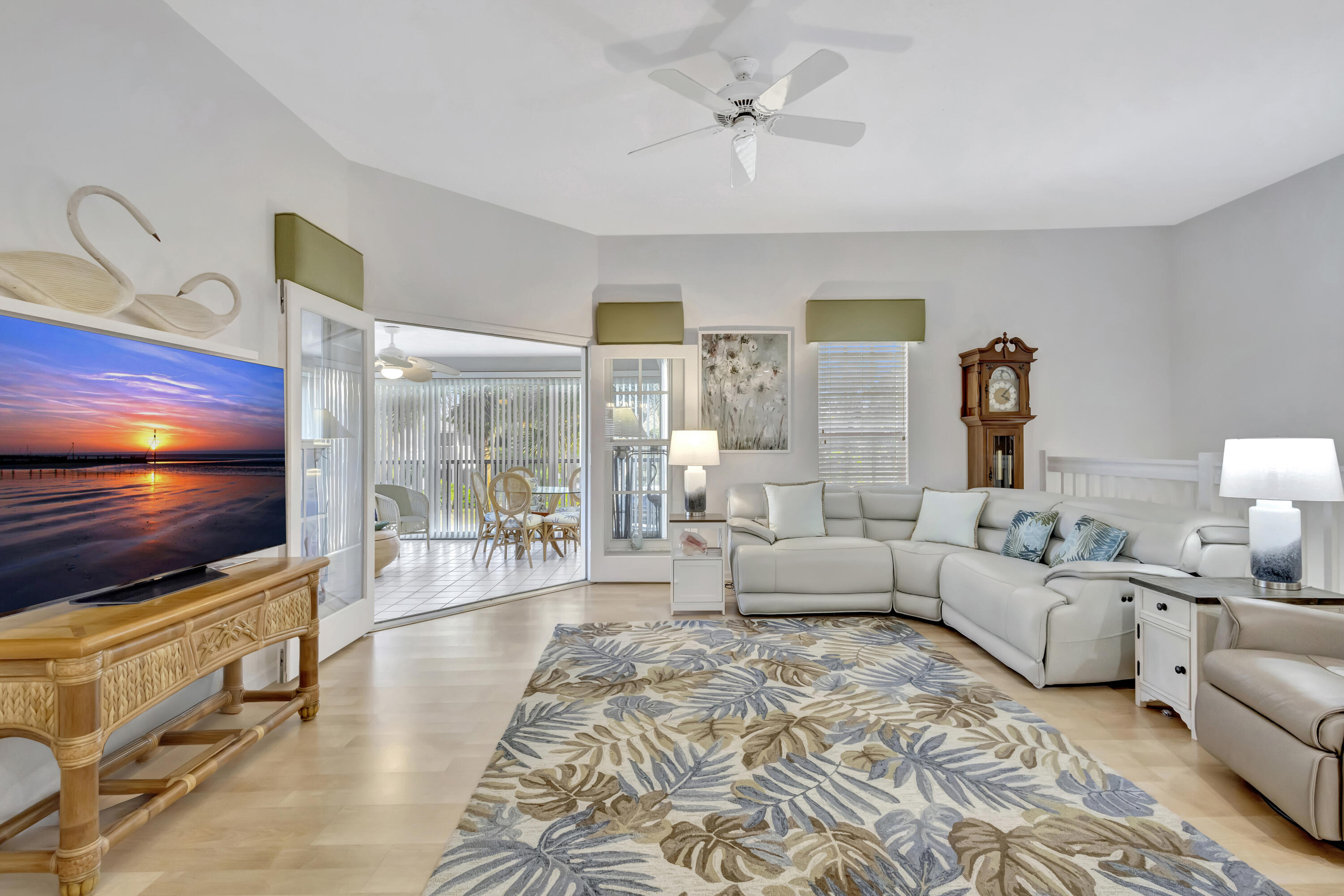 411 Northeast Plantation Road, Unit 522 Stuart, FL 34996 - Photo 6 of 52 a living room with furniture and a flat screen tv