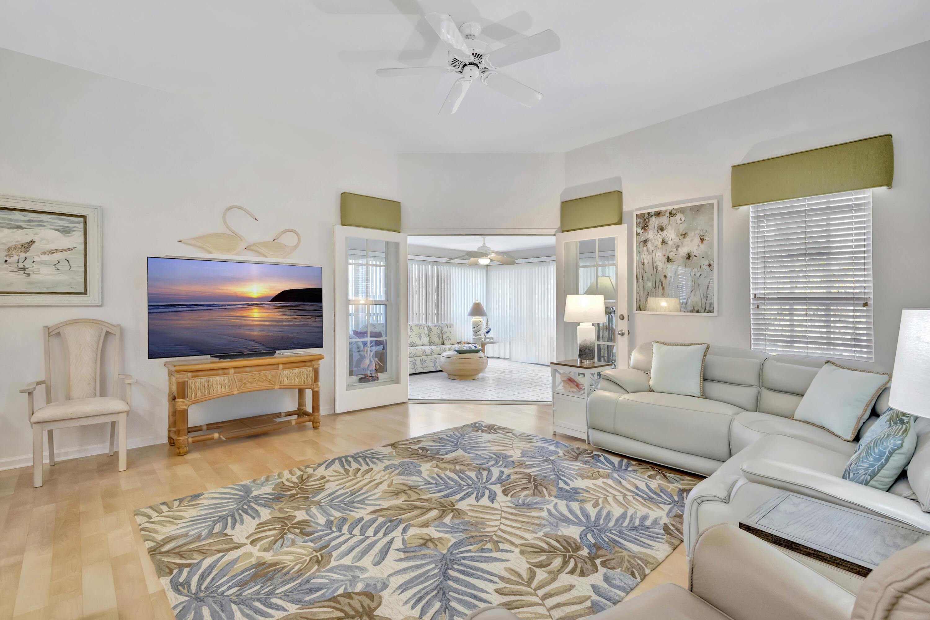 411 Northeast Plantation Road, Unit 522 Stuart, FL 34996 - Photo 8 of 52 a living room with furniture and a flat screen tv