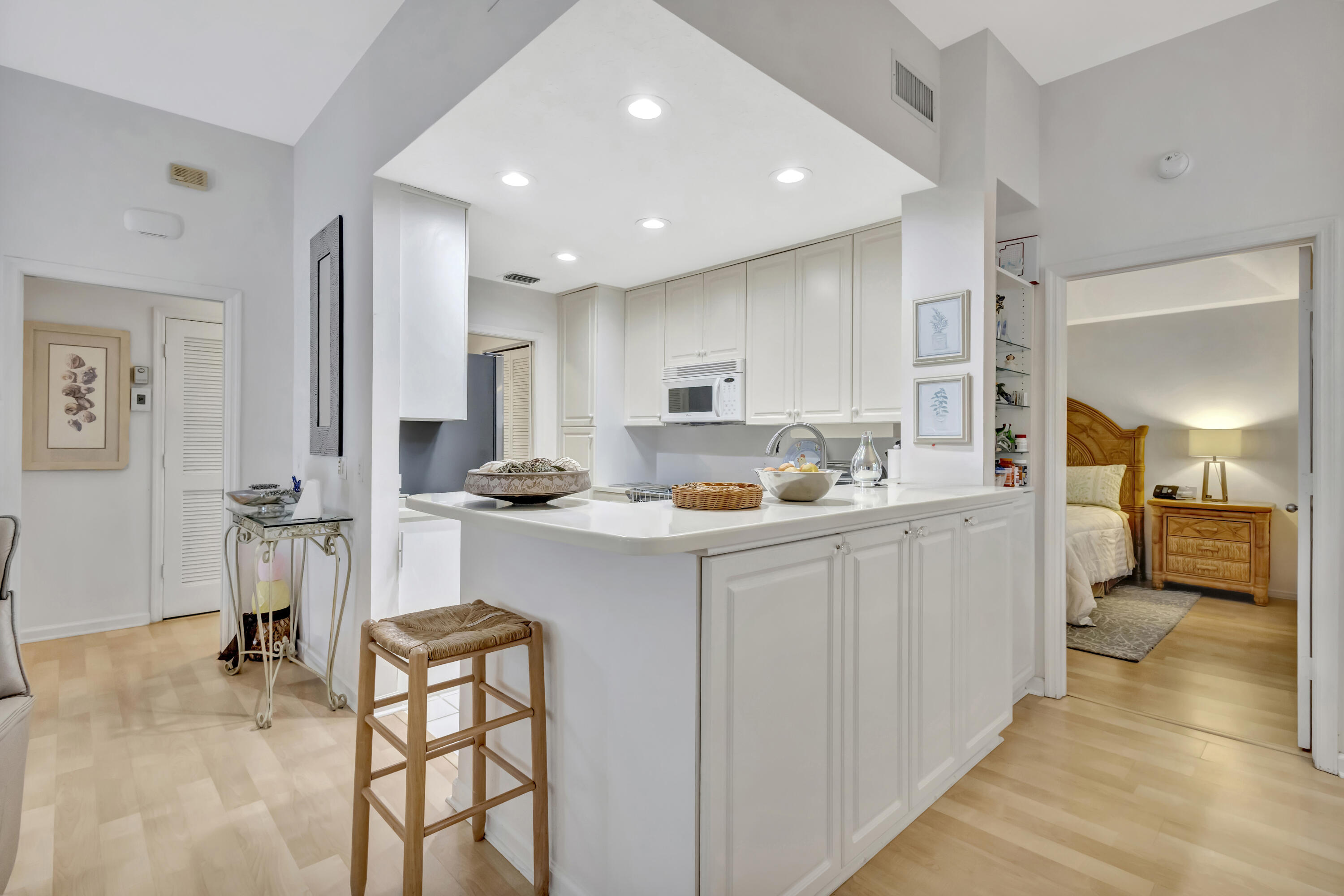 411 Northeast Plantation Road, Unit 522 Stuart, FL 34996 - Photo 9 of 52 a kitchen with stainless steel appliances kitchen island granite countertop a sink and cabinets