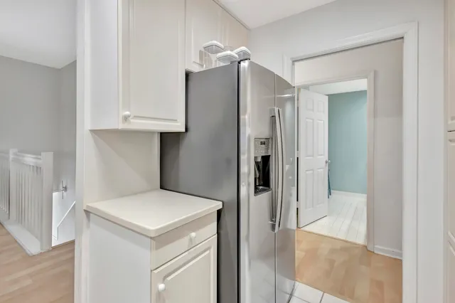a kitchen with a sink cabinets and appliances
