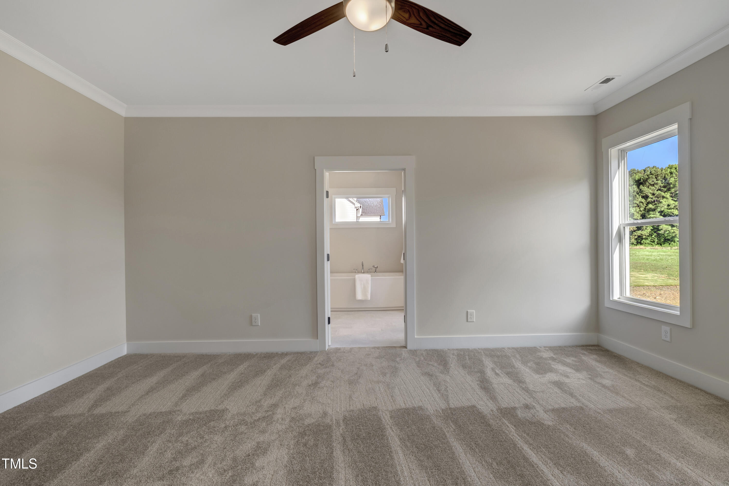 0 Radio Tower Road Wilson, NC 27893 - Photo 15 of 48 an empty room with a window and a ceiling fan